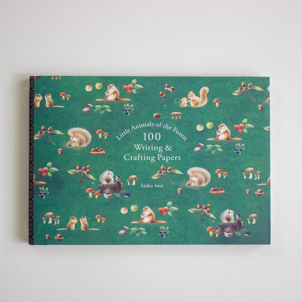 Book titled 'Little Animals of the Forest' with illustrations on a green background