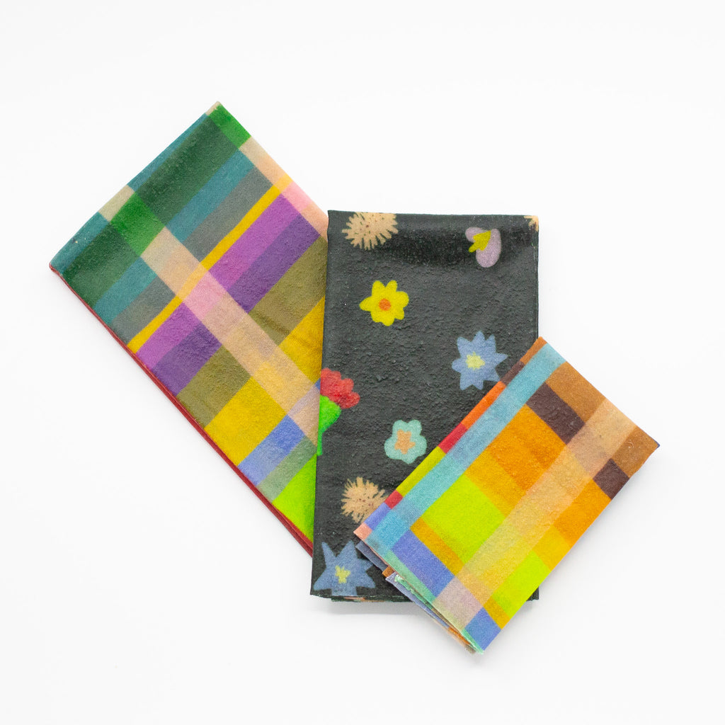 A top view of the 3 bees wax wraps, comparing their sizes and showing the 3 different prints. 