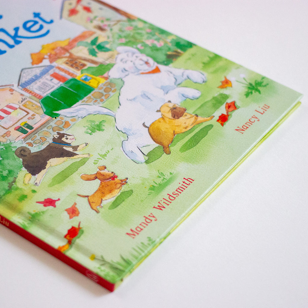 Children's book with colourful illustrations of animals and a house on a white background