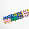 Colorful patterned strip with geometric design on a white background