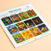 A 2027 spiral-bound Anna Seed Art calendar page shown at an angle on a warm beige background. The page features twelve colourful monthly illustrations labeled with the months, with the brand name 'ANNA SEED ART' at the top.