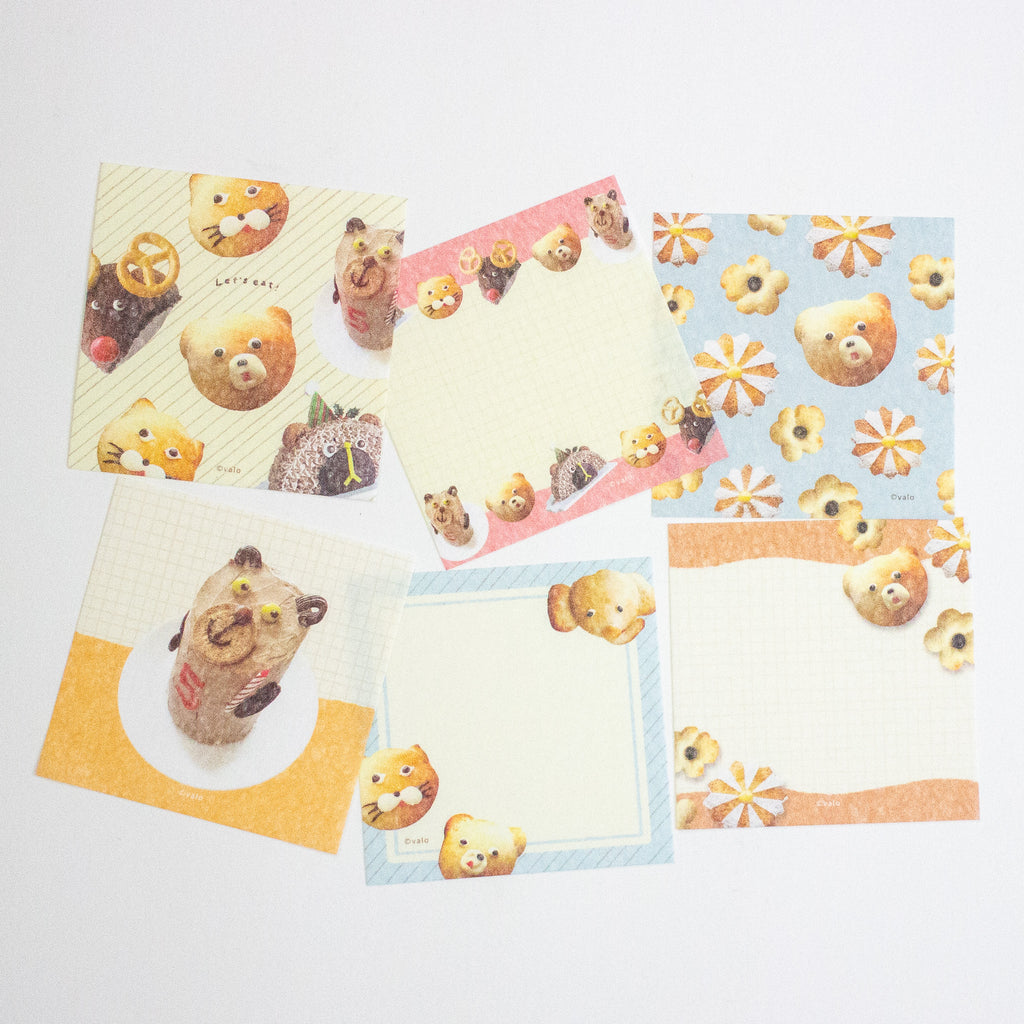 A set of cute bear-themed stationery notepads and memo cards arranged on a plain white background. The designs feature various pastel colors including yellow, pink, blue, and orange, with illustrations of bears, flowers, and food items.