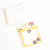 A stack of loose cute, pastel-coloured memo sheets with animal and food illustrations, photographed on a clean white background.