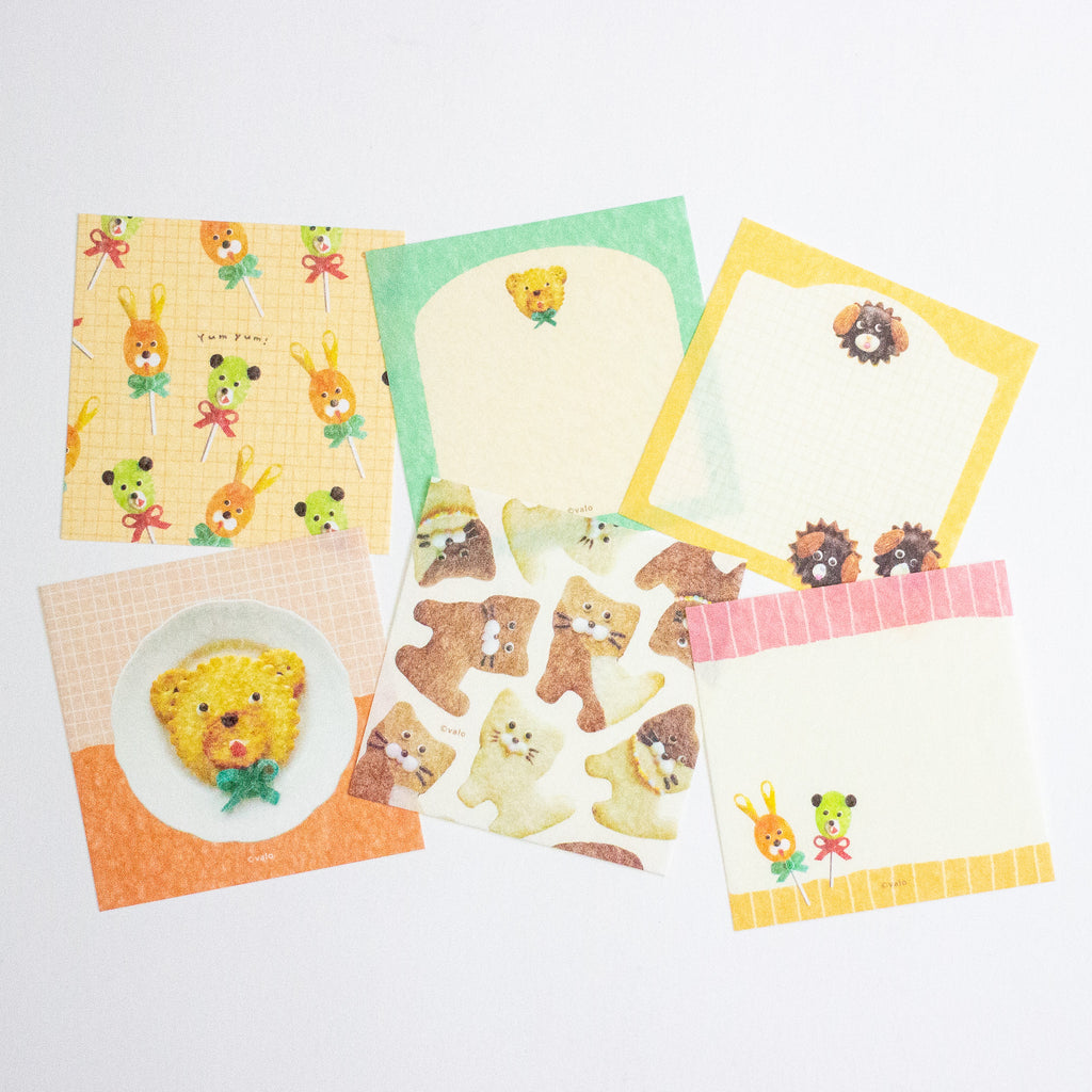 A set of cute, pastel-themed memo sheets featuring cartoon bear, bunny, and food illustrations on a clean white background.