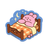 A sticker of a bunny cartoon sleeping on a bed tucked in with a check-pattern blanket. 