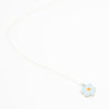 Flower-shaped pendant on a white background