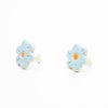 A photo of the bluebell stud earrings. Ceramic earrings with a flower shape and light blue colour leaves with a orange centre. Side view shows sterling silver stud backings. 