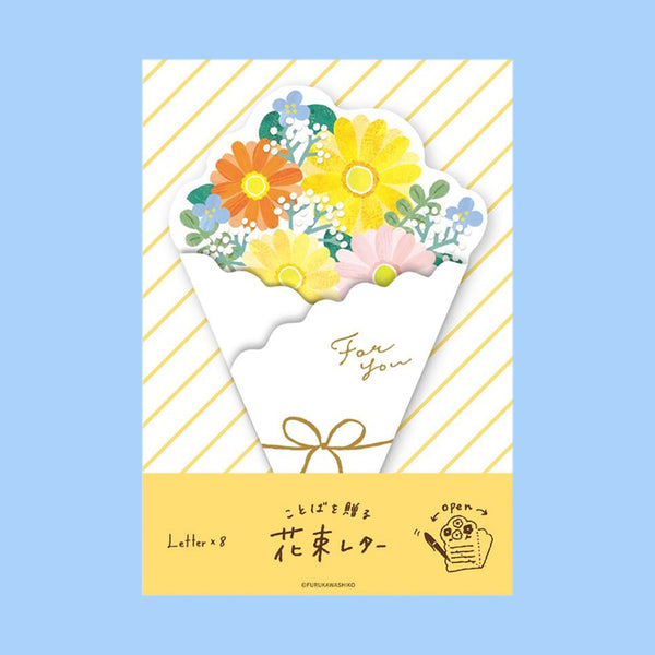 A floral envelope-style card with a bouquet illustration in yellow, orange, pink, blue, and green on a white envelope shape, set against a pale blue background with gold diagonal stripes and a yellow band containing Japanese text.