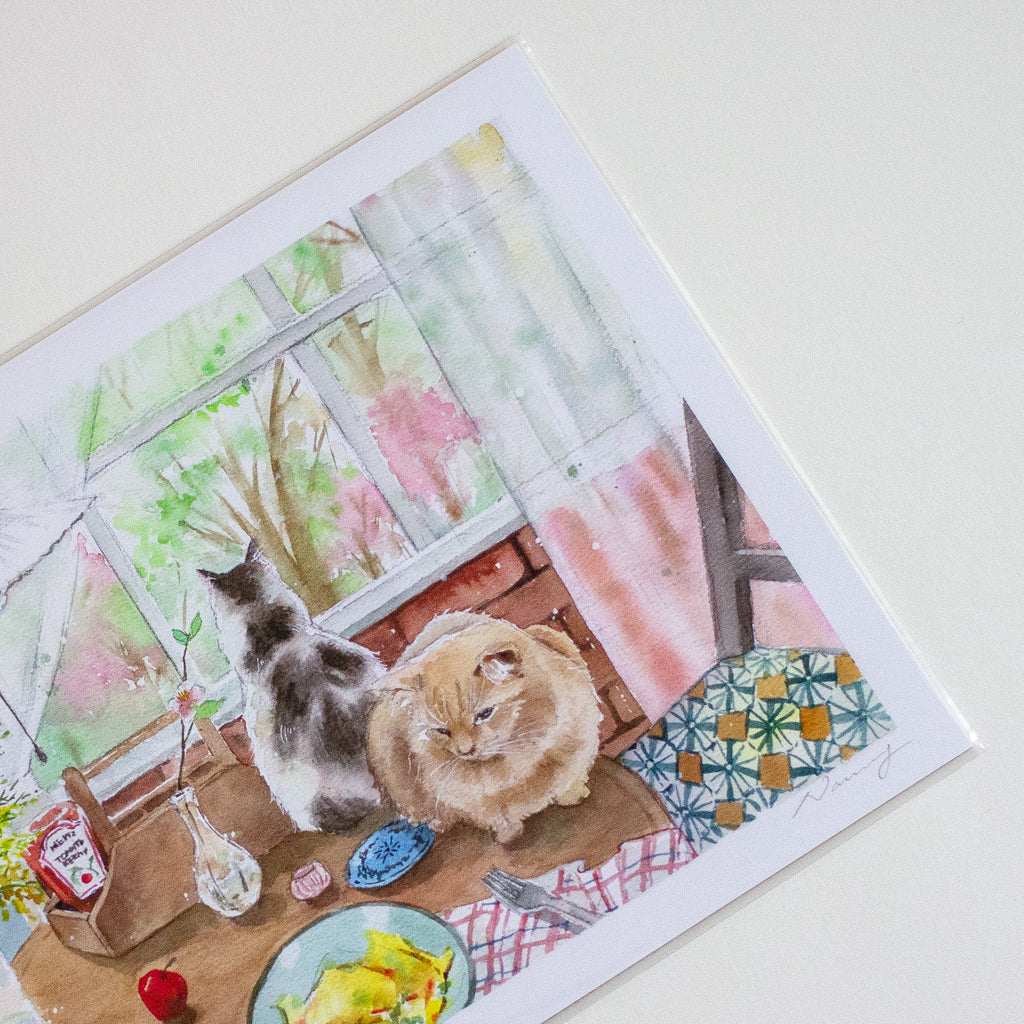 Illustration of two cats on a table with a window and flowers in the background
