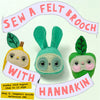 Promotional graphic for a felt brooch sewing class, featuring three cute felt bunny-like characters in yellow, green, and teal, with banners reading 'SEW A FELT BROOCH' and 'WITH HANNAKIN'.