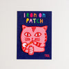 Pink cat patch on a blue card with colourful text