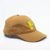 Side view of a mustard baseball cap with a yellow bunny and green clover embroidered design