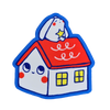 A cute cartoon house sticker or patch featuring a white house with a red roof, blue outline, yellow windows, and a white bunny on top holding a star, shown on a plain white background.