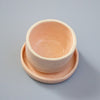Ceramic bowl with saucer on a blue background