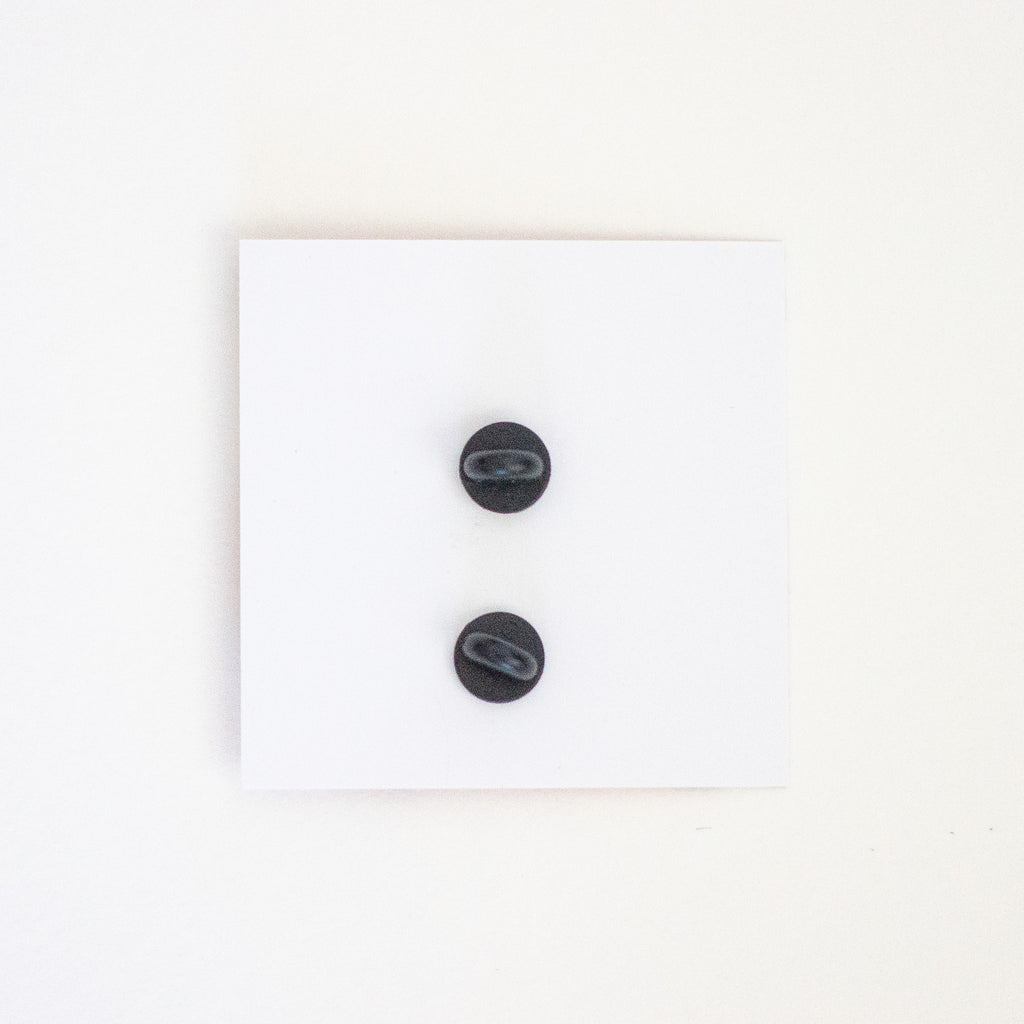 Picture of the back of the card and pins attached, showing the pin clasp. 