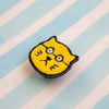 Yellow cat-shaped patch on a striped background