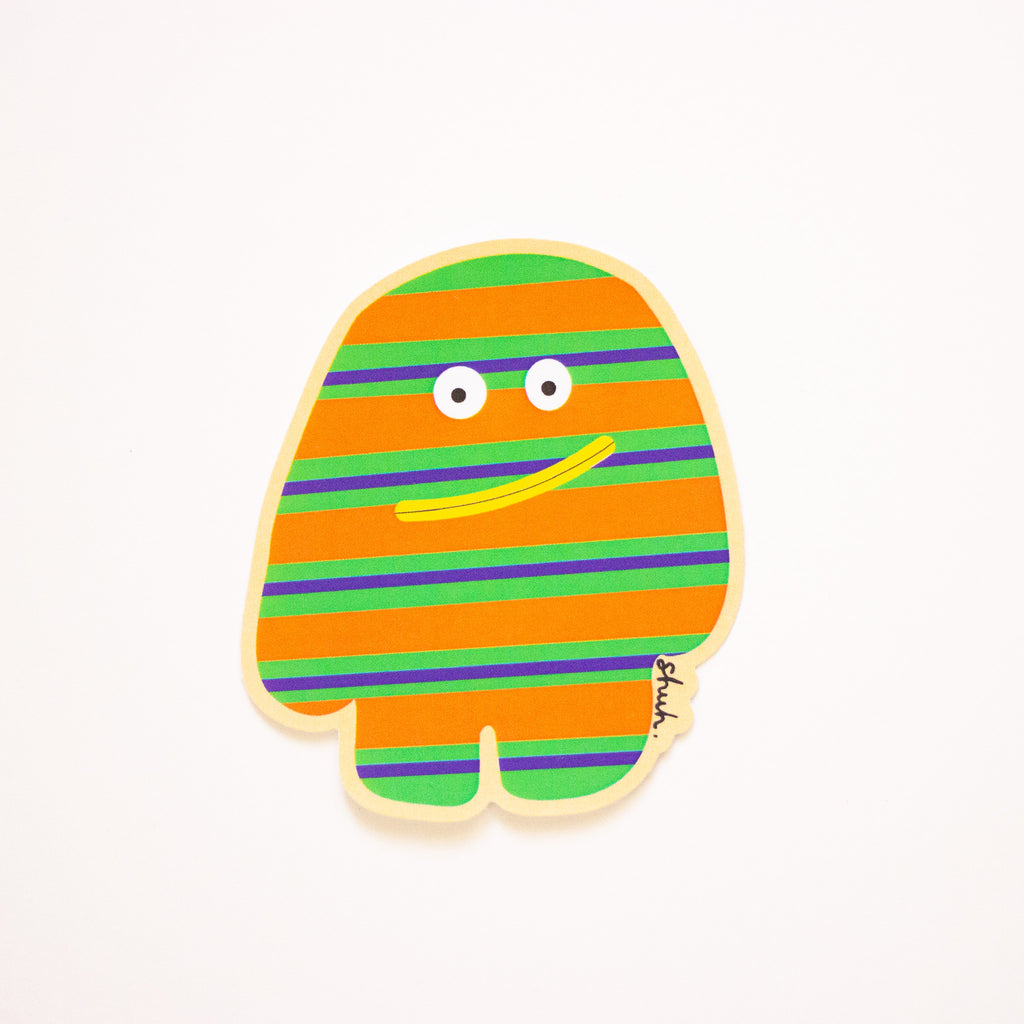 A multicoloured striped monster, green, orange, and purple horizontal stripes and a yellow mouth. 