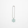 Necklace with a light blue cloud-shaped charm on a white background