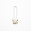 Cat-shaped charm on a white background