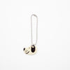 Dog-shaped Charm on a white background
