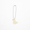 A small white duck charm on a white background