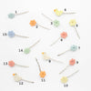 Set of colorful hairpins with numbers on a white background