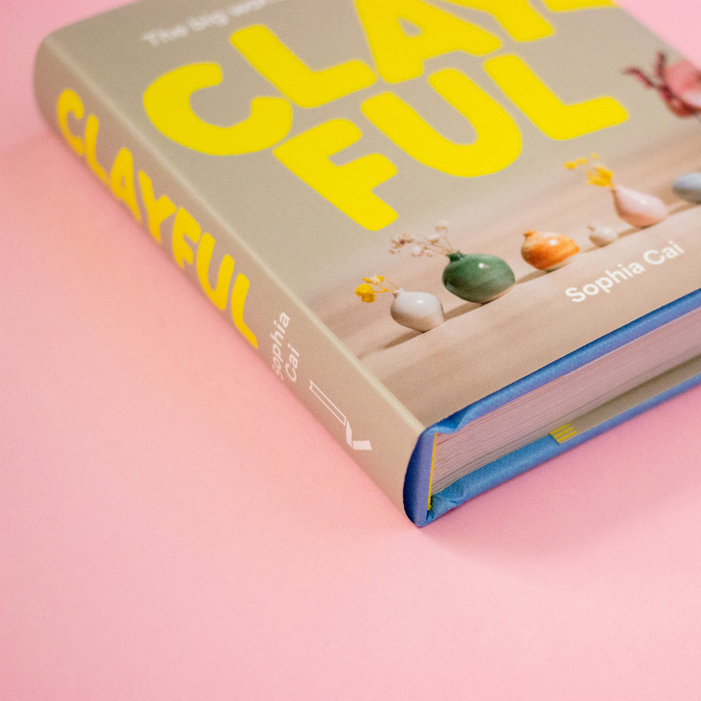 Book titled 'Clayful' by Sophia Cal on a pink background