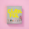 Book titled 'CLAYFUL' by Sophia Cai on a pink background