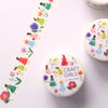 A close-up of decorative paper strips featuring a repeating illustration of girls in colourful dresses walking beside flowers, photographed on a white surface.
