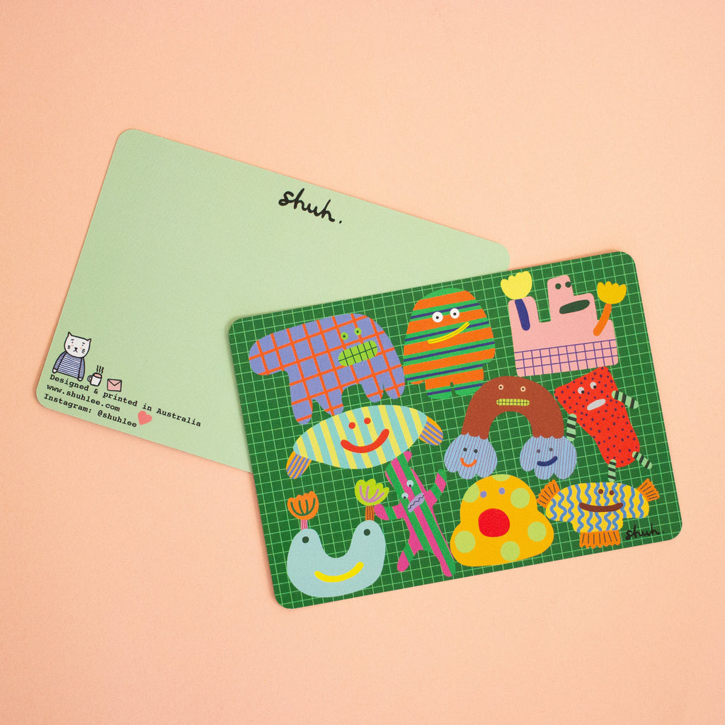 Colorful monster character postcard with original characters on a green grid background. Reverse side is blank for your messages. 