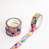 Three rolls of washi tape with a colourful cartoon monster pattern, displayed on a clean white background.