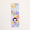 A tall, narrow rectangular bookmark with a colourful floral pattern and a simple illustration of a person at the bottom, shown against a plain light background. The text reads 'shuhlee printed in australia shuhlee.com'