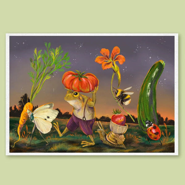 A framed art print featuring a whimsical surrealist illustration of a frog carrying a tomato on its head, surrounded by vegetables like a carrot, cucumber, radish, and a flower, set against a starry night sky. The print is displayed on a solid pale green background.
