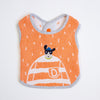 An orange baby bib with a white and grey striped trim, featuring a graphic of a dog peeking out of a striped jumper with a letter 'D' on the front.