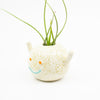Side view of don vase. Natural glaze and blue smile. 