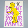 A graphic art print featuring a yellow cartoon figure with a speech bubble that says 'TEE HEE' over large purple text reading 'DON'T SHIT YOUR PANTS' on a white background, photographed against a gray backdrop.