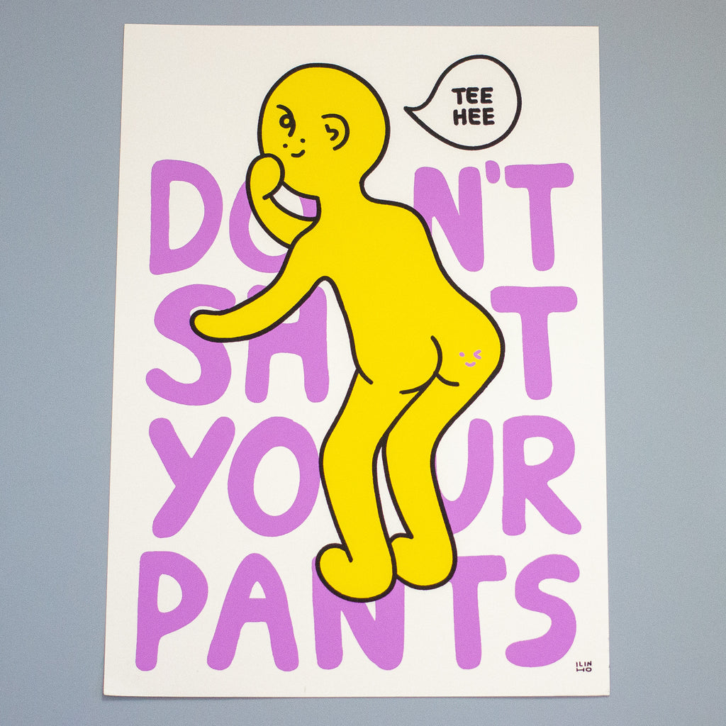 A graphic art print featuring a yellow cartoon figure with a speech bubble that says 'TEE HEE' over large purple text reading 'DON'T SHIT YOUR PANTS' on a white background, photographed against a gray backdrop.