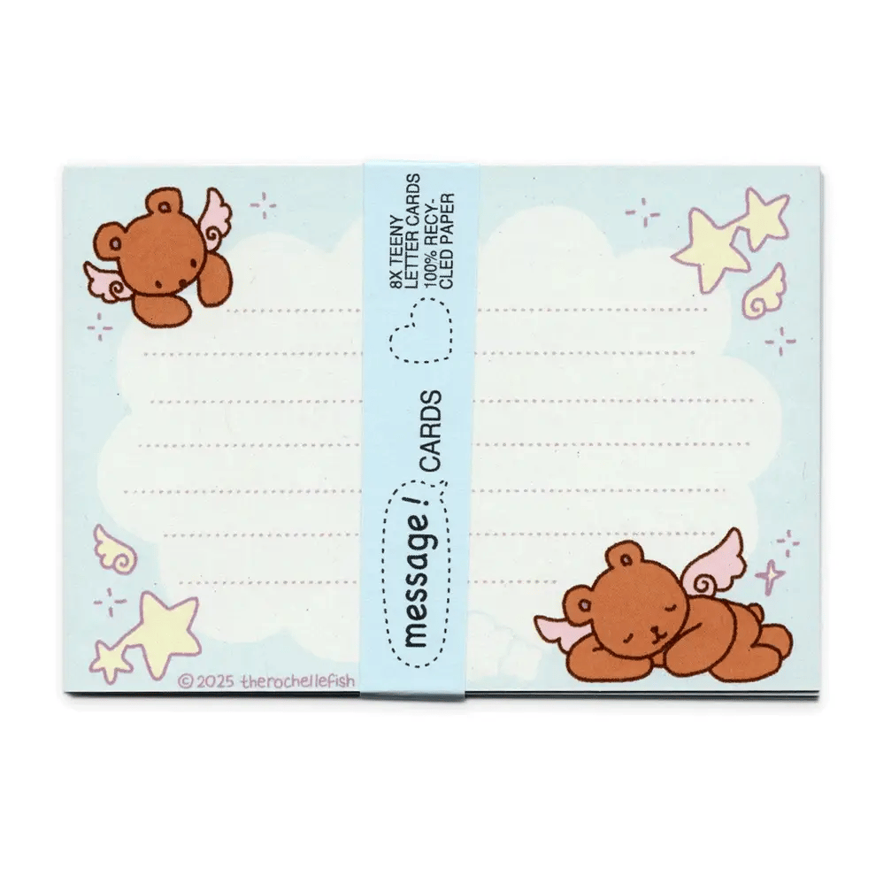 A blue pack of cute message cards featuring cartoon teddy bears, stars, stars, and wings, wrapped with a blue paper band labeled 'message cards'.