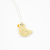 Beige Duck-shaped pendant on a silver chain against a white background
