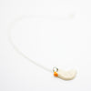 White Duck-shaped necklace on a white background