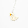 White Duck-shaped pendant on a chain against a white background