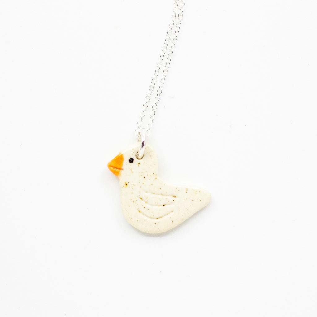 White Duck-shaped pendant on a chain against a white background