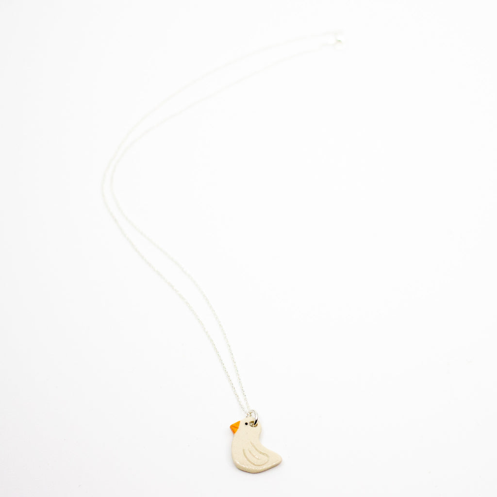 Necklace with a small Duck pendant on a white background