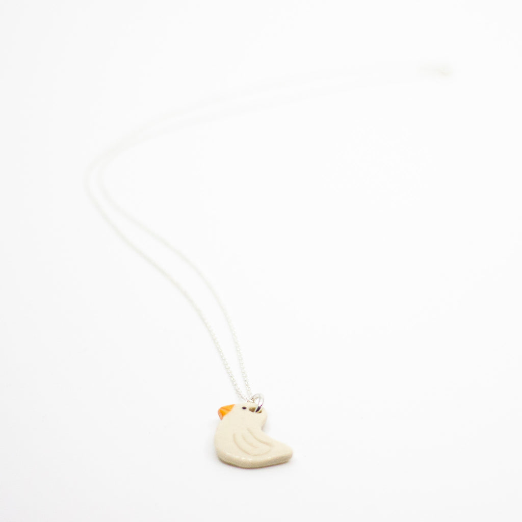 Necklace with a small Duck pendant on a white background