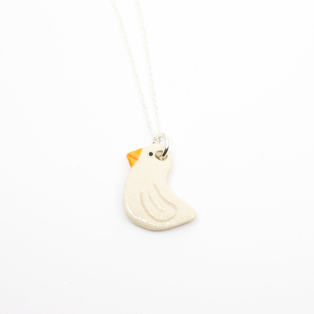 Necklace with a small Duck pendant on a white background