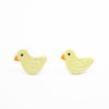 Pair of yellow duck-shaped earrings on a white background