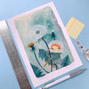 Illustration of a girl with dandelions on a blue background with stationery items.