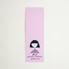 A long, narrow pink bookmark with a simple black line drawing of a person and the text 'shuh. printed in australia shuhlee.com'.