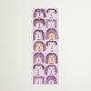 A vertical rectangular bookmark with a repeating pattern of stylised faces, shown flat against a light cream background.