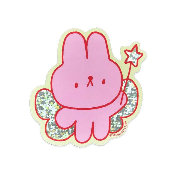 A pink cartoon bunny sticker with red outlines, glittery green wings, and a small star wand, shown on a plain white background.
